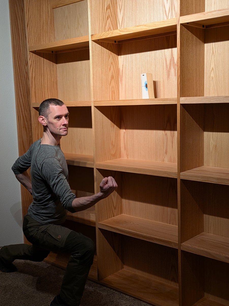 A floor to ceiling bookshelf I built for my wife. I thought loving her was enough to make this possible; it also required 200 man hours and the tutelage of a professional carpenter.